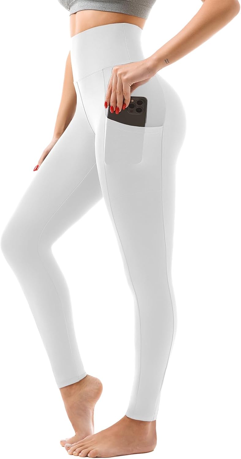 Person wearing black leggings with a pocket on a white background
