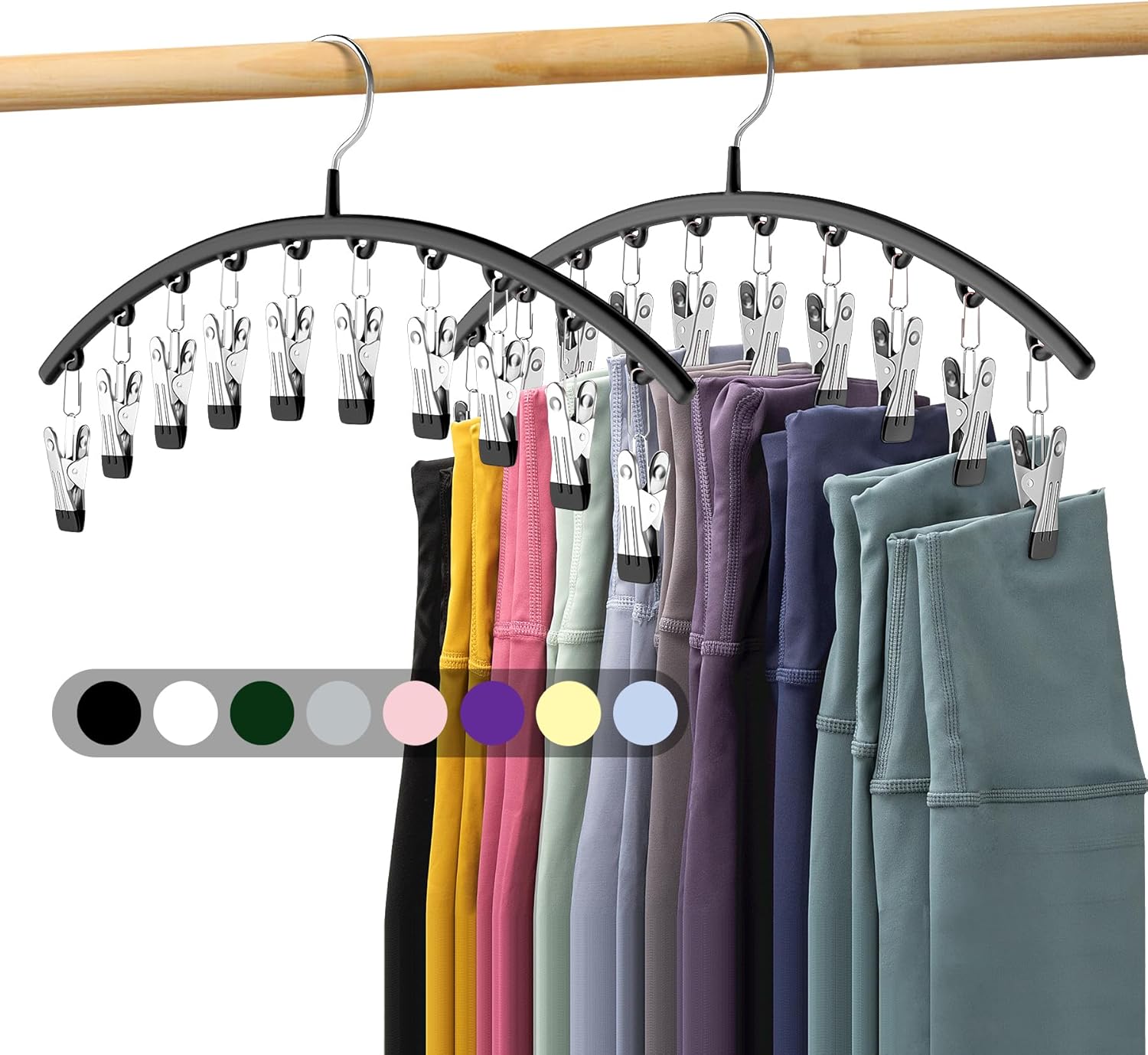 Hanger with multiple pairs of pants and clips on a wooden rod.