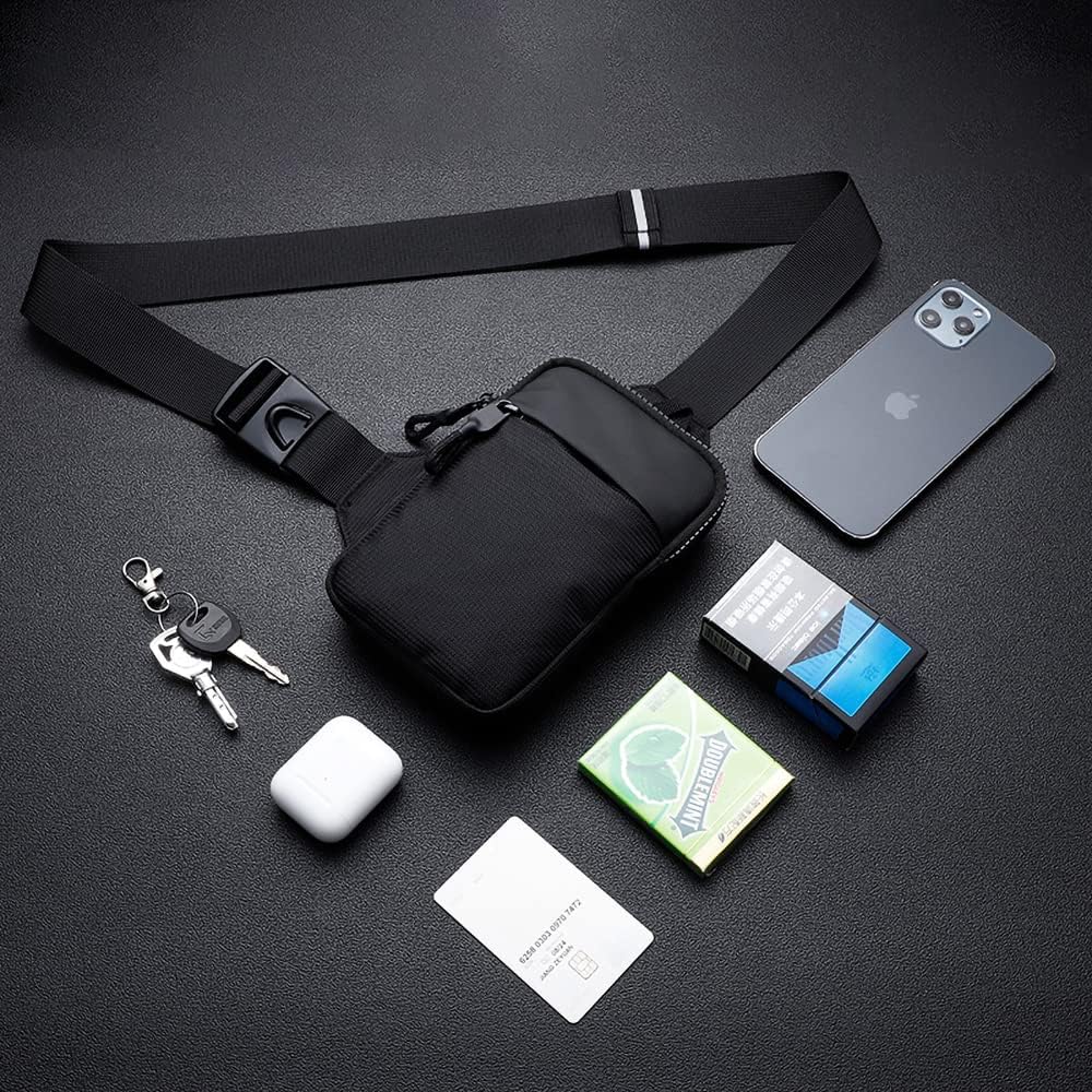 Black waist bag with phone, keys, and other items on a dark surface